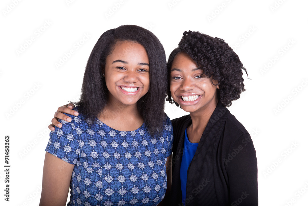 A couple of teenage sisters isolated on white A couple of teenage sisters isolated on white