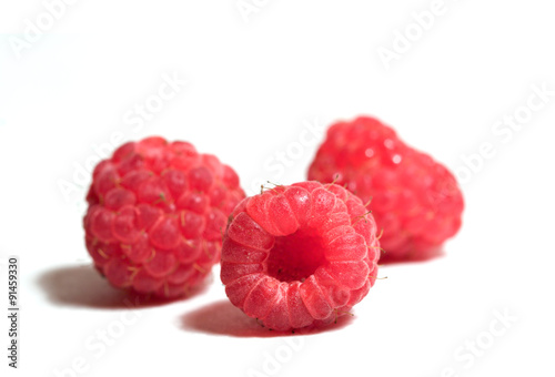 Three Raspberries on White