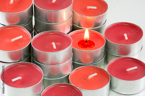 Red candles on white background