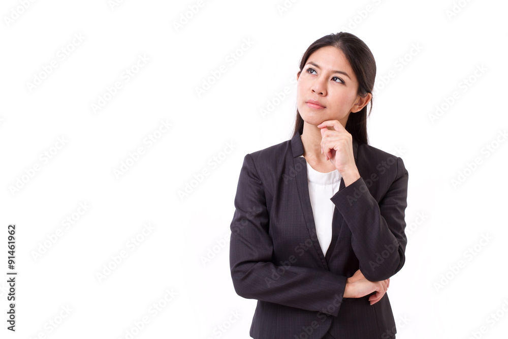 serious businesswoman thinking, looking up serious businesswoman thinking, looking up