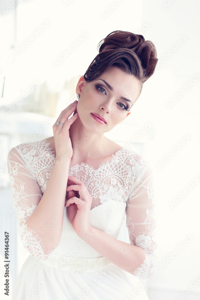 Young gorgeous bride is sitting in antique armchair Young gorgeous bride is sitting in antique armchair