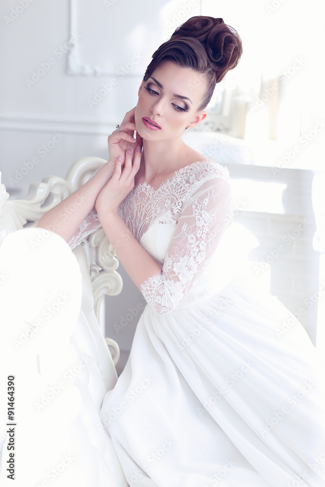 Young gorgeous bride sitting in antique interior Young gorgeous bride sitting in antique interior