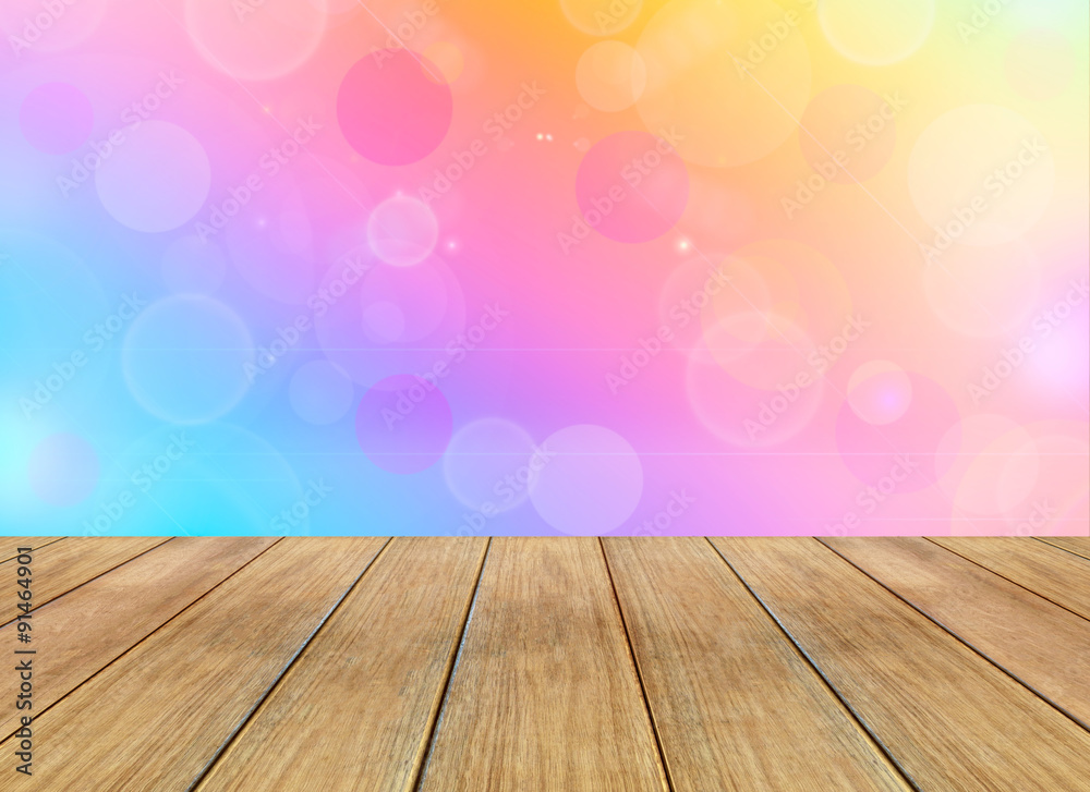 Abstract colorful background with bokeh lights and wooden plank Abstract colorful background with bokeh lights and wooden plank