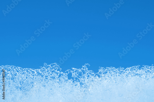 Winter background. An ice edge against the blue sky. © Leonid Ikan