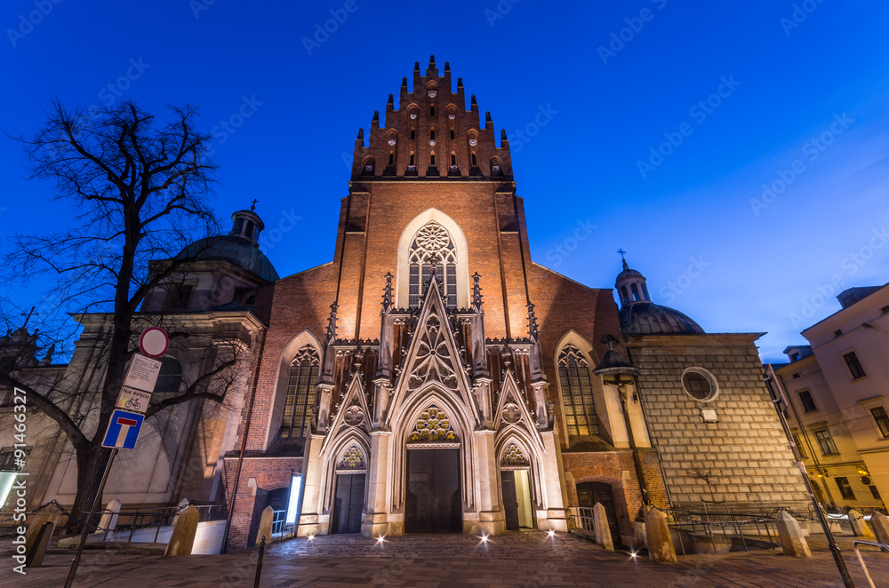 Krakow, Poland, the dominican church of Holy Trinity, built in the XIII th century in the gothic style, in the morning. Krakow, Poland, the dominican church of Holy Trinity, built in the XIII th century in the gothic style, in the morning.