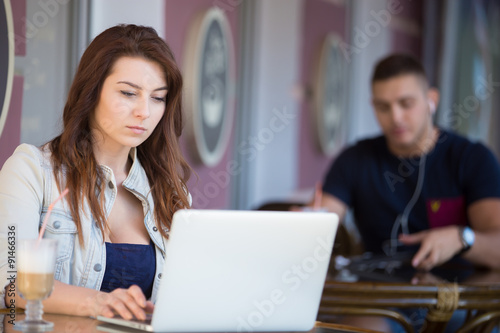 Good-looking young woman at a cafe