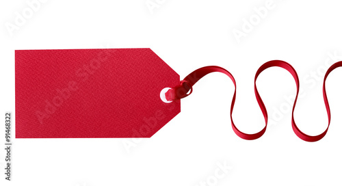 Red gift tag for christmas or birthday present tied with ribbon straight horizontal isolated on white background photo