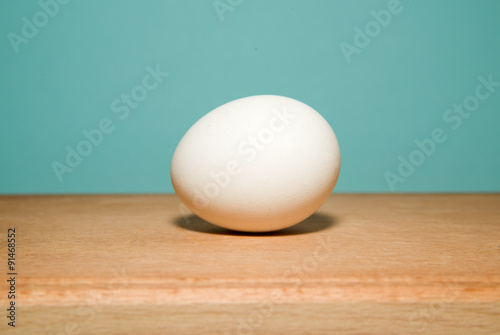 Egg white is on a wooden surface