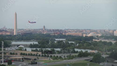 Washington DC cityscape and airplane flying on the sky, USA.