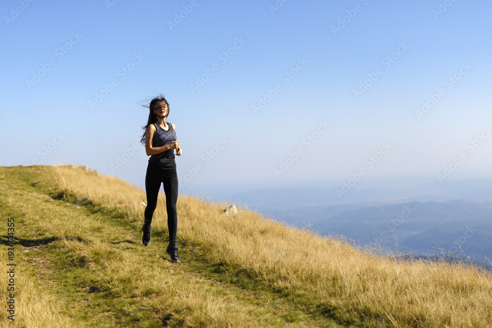 Exercising fitness woman doing exercises in nature. Girl doing m