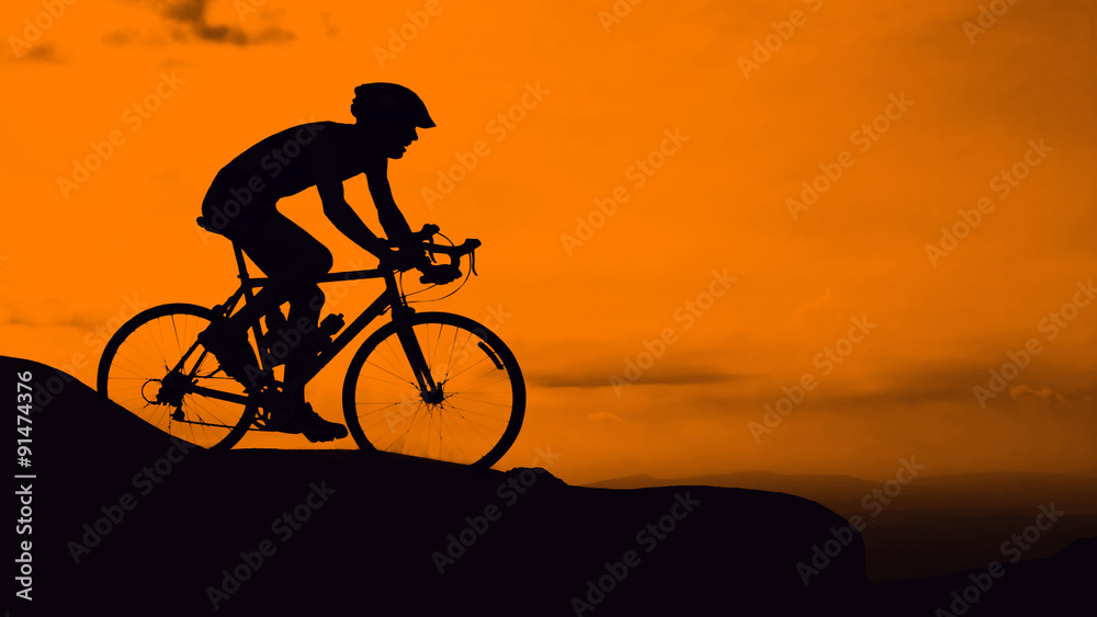 Fototapeta premium Man cycling on mountain