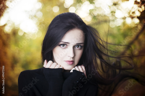 Beautiful woman in autumn forest