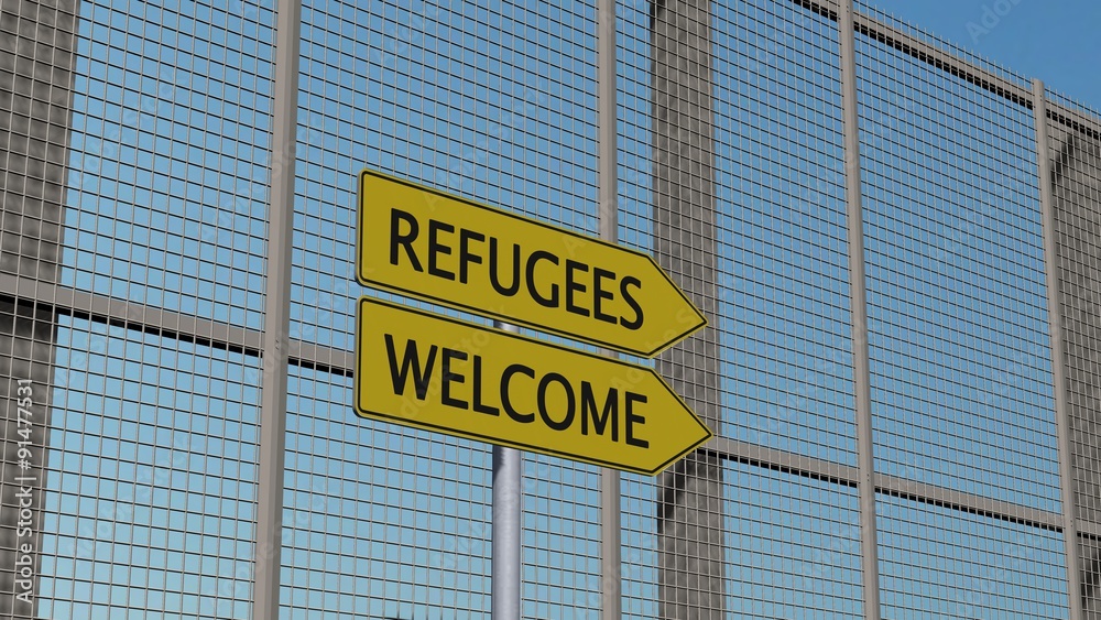 Obraz premium Refugees / Welcome Signpost on metall fence / border fence