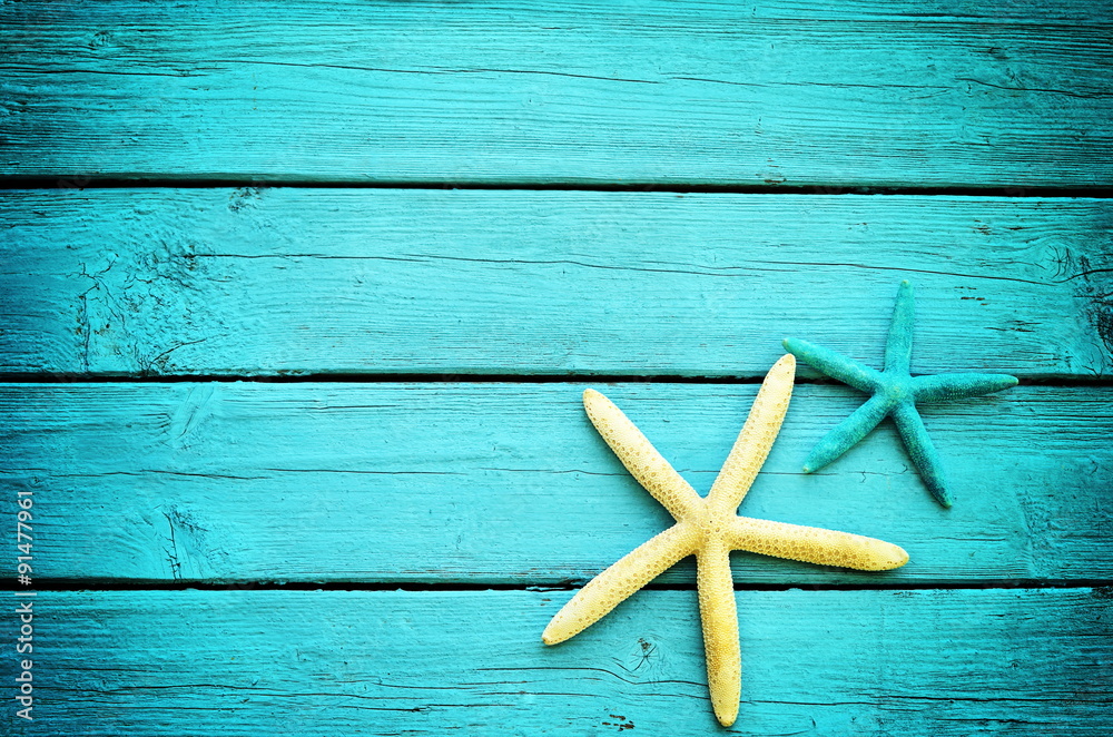 starfish on the blue wooden background starfish on the blue wooden background