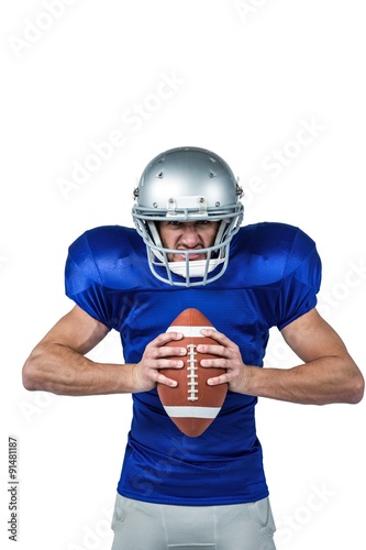 Angry American football player holding ball