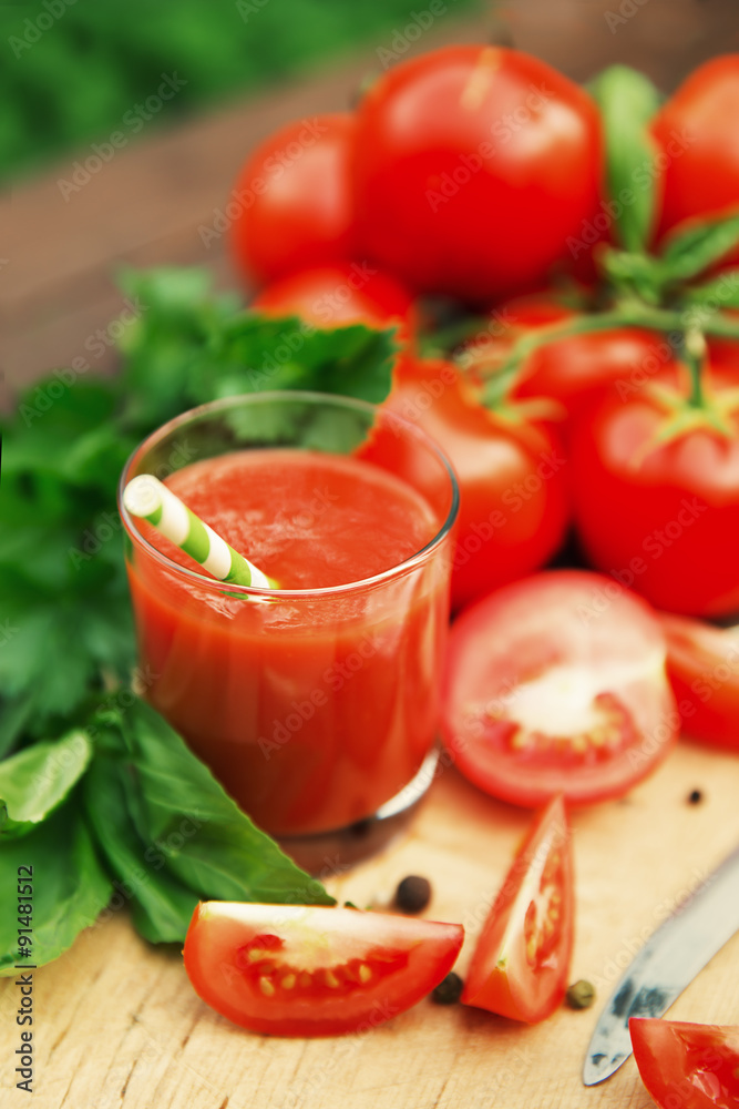 Fresh tomato juice on wooden background Fresh tomato juice on wooden background