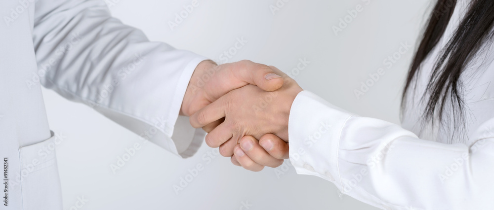 Patient shaking hands with doctor Patient shaking hands with doctor