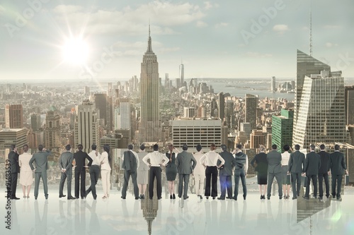 Composite image of rear view of multiethnic business people