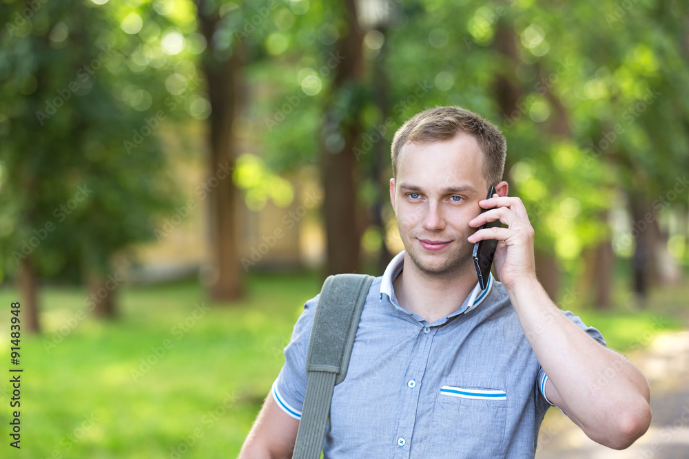 Young man using a smart phone Young man using a smart phone