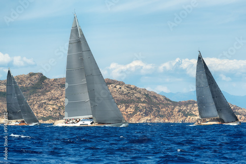 group yacht sailing in regatta