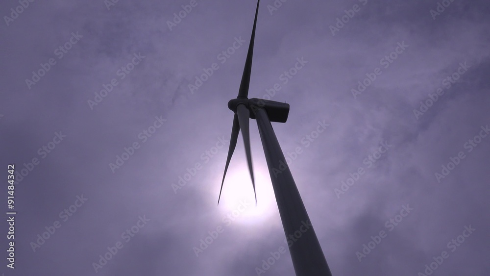 Low angle of a windmill generating electricity. Low angle of a windmill generating electricity.
