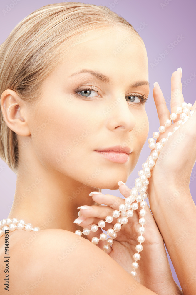 beautiful woman with pearl necklace over violet