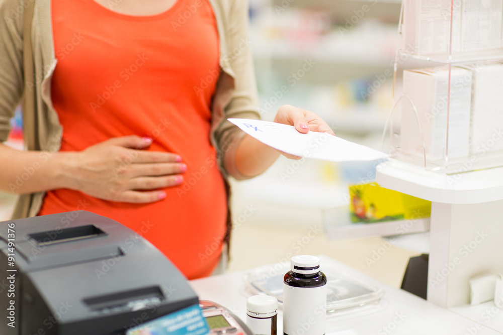 pregnant woman buying medication at pharmacy pregnant woman buying medication at pharmacy