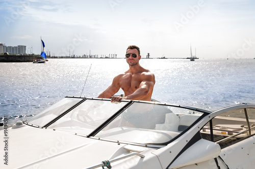 Muscle man on a boat