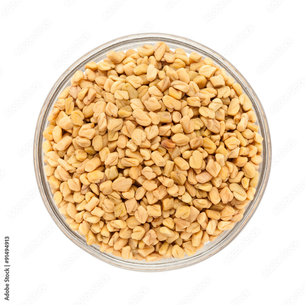 Top view of Organic Fenugreek (Trigonella foenum-graecum) in glass bowl isolated on white background Top view of Organic Fenugreek (Trigonella foenum-graecum) in glass bowl isolated on white background