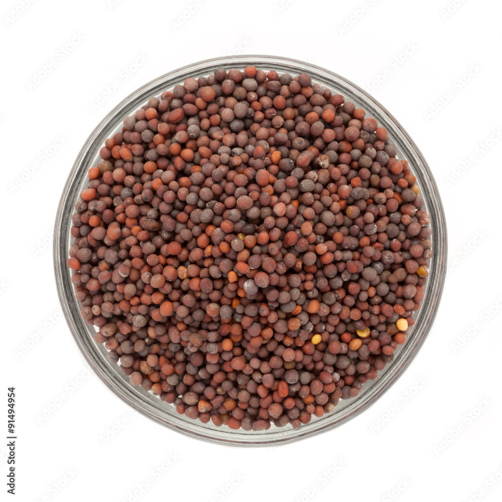 Top view of Organic brown mustard (Brassica juncea) in glass bowl isolated on white background. Top view of Organic brown mustard (Brassica juncea) in glass bowl isolated on white background.