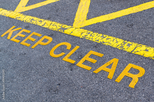 Keep Clear Yellow Paint on Asphalt