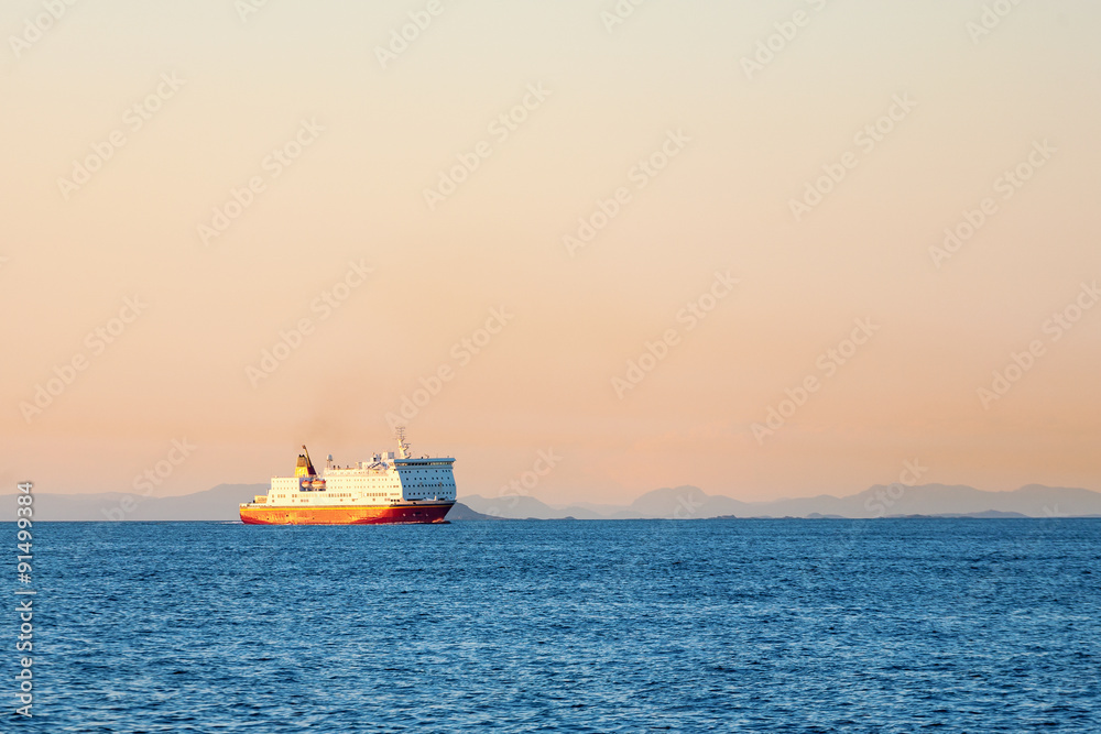 Ferry on the sea at sunset Ferry on the sea at sunset