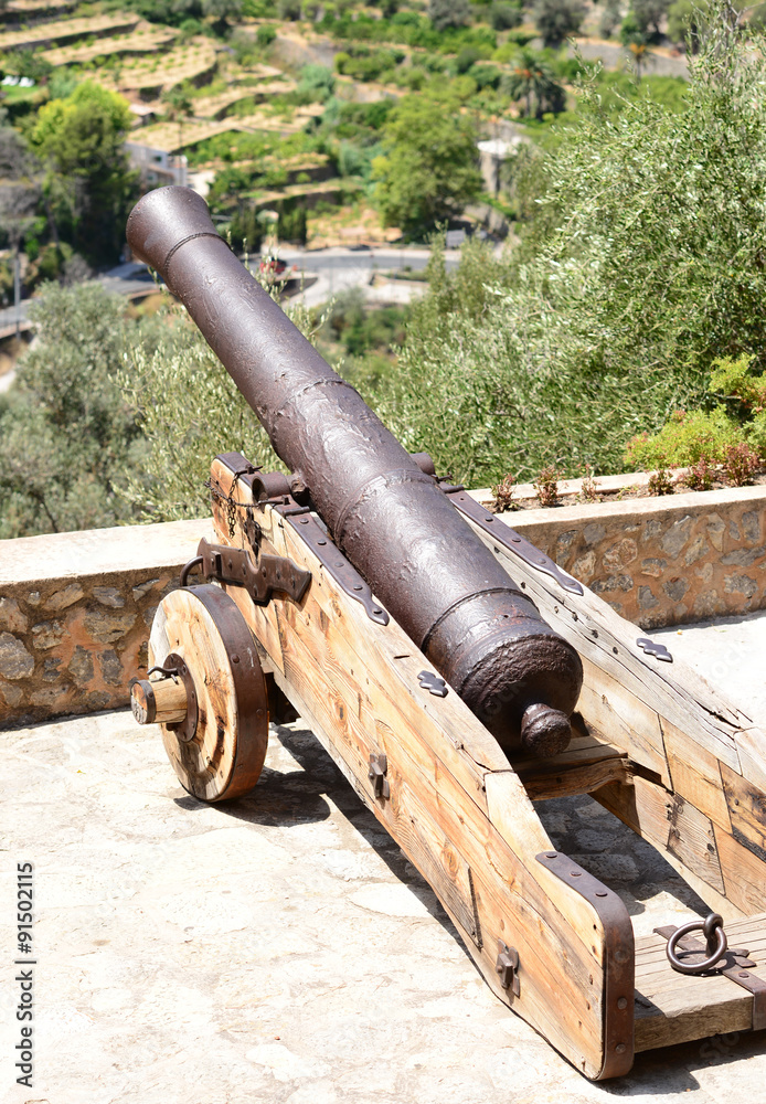 Old cannon at mountain village Deia, Mallorca, Spain Old cannon at mountain village Deia, Mallorca, Spain
