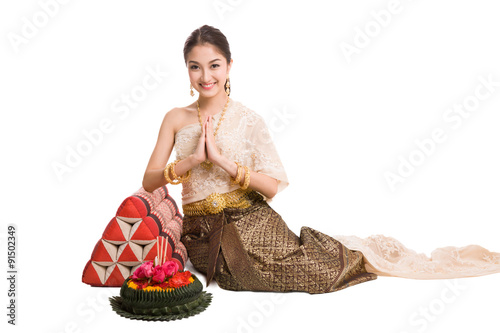 Thai women welcome with traditional Thai suit in Studio photo