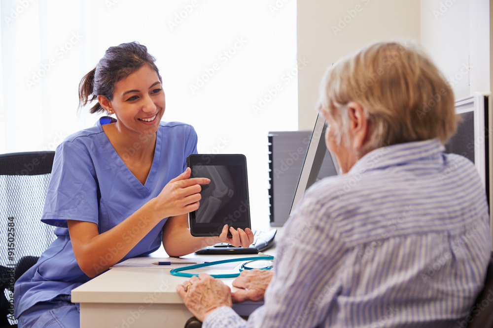 Senior Patient Having Consultation With Nurse In Office Senior Patient Having Consultation With Nurse In Office