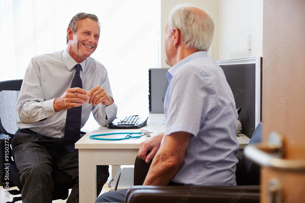 Senior Patient Having Consultation With Doctor In Office Senior Patient Having Consultation With Doctor In Office