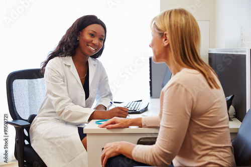 Patient Having Consultation With Female Doctor In Office