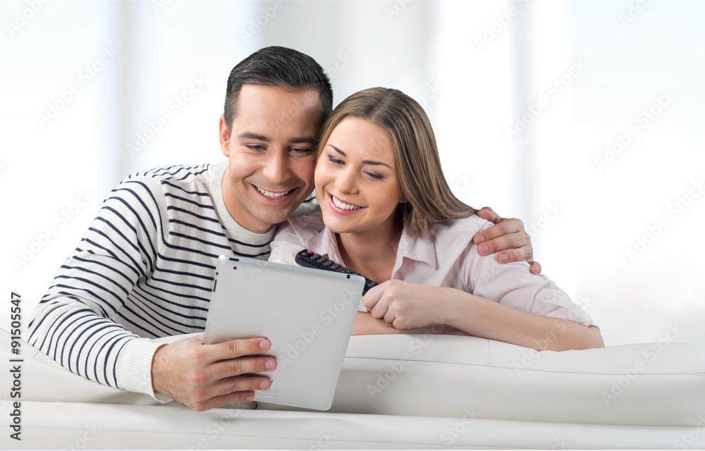 Tablet watching
couch. Tablet watching
couch.