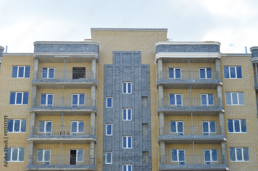 facade of an apartment building against the sky
