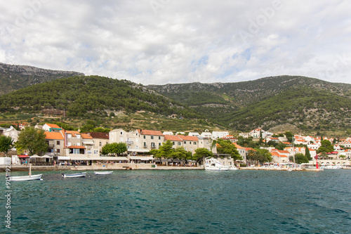 View of Bol town from the sea at the Brac island in Croatia. © tuomaslehtinen