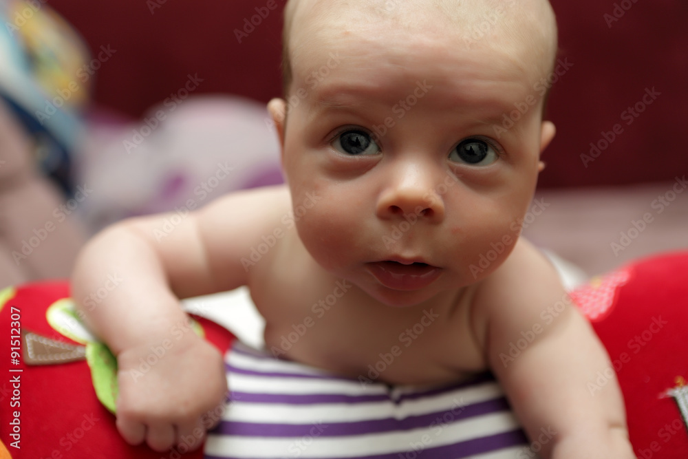 Pensive baby boy on crawling roll Pensive baby boy on crawling roll