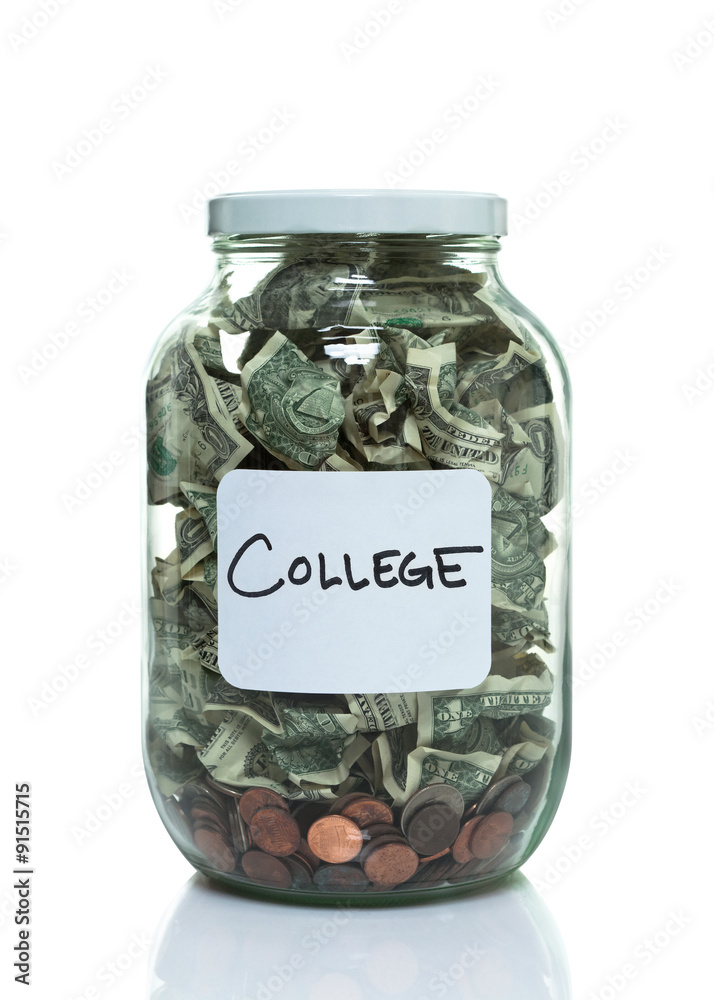 Glass jar full of money with a white college label Glass jar full of money with a white college label