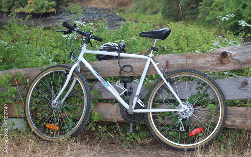 Bike on split rail wooden Fence