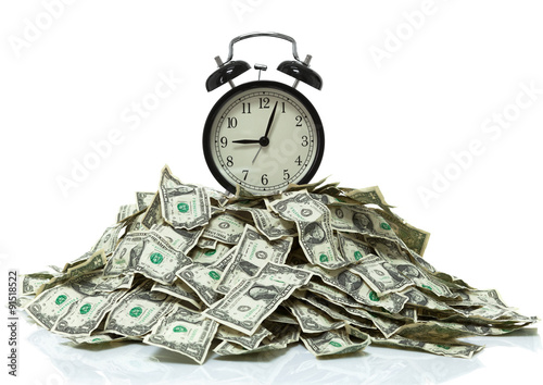 Clock on top of a pile of cash