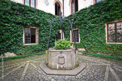 Old well in the courtyard of the Sychrov castle photo