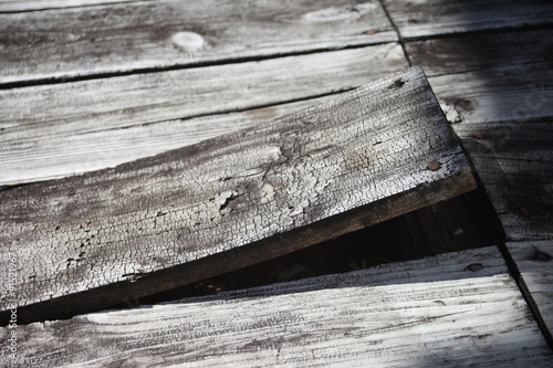 Weathered deck board came loose and needs repair