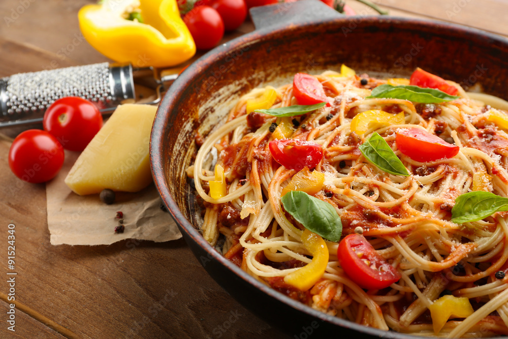 Homemade Spaghetti Bolognese on pan, on wooden background Homemade Spaghetti Bolognese on pan, on wooden background