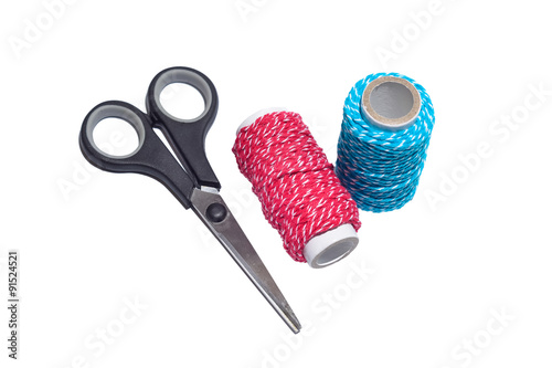 Thread with scissor on white isolated background