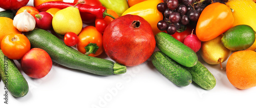 Heap of fruits and vegetables isolated on white