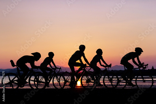 People cycling at beach